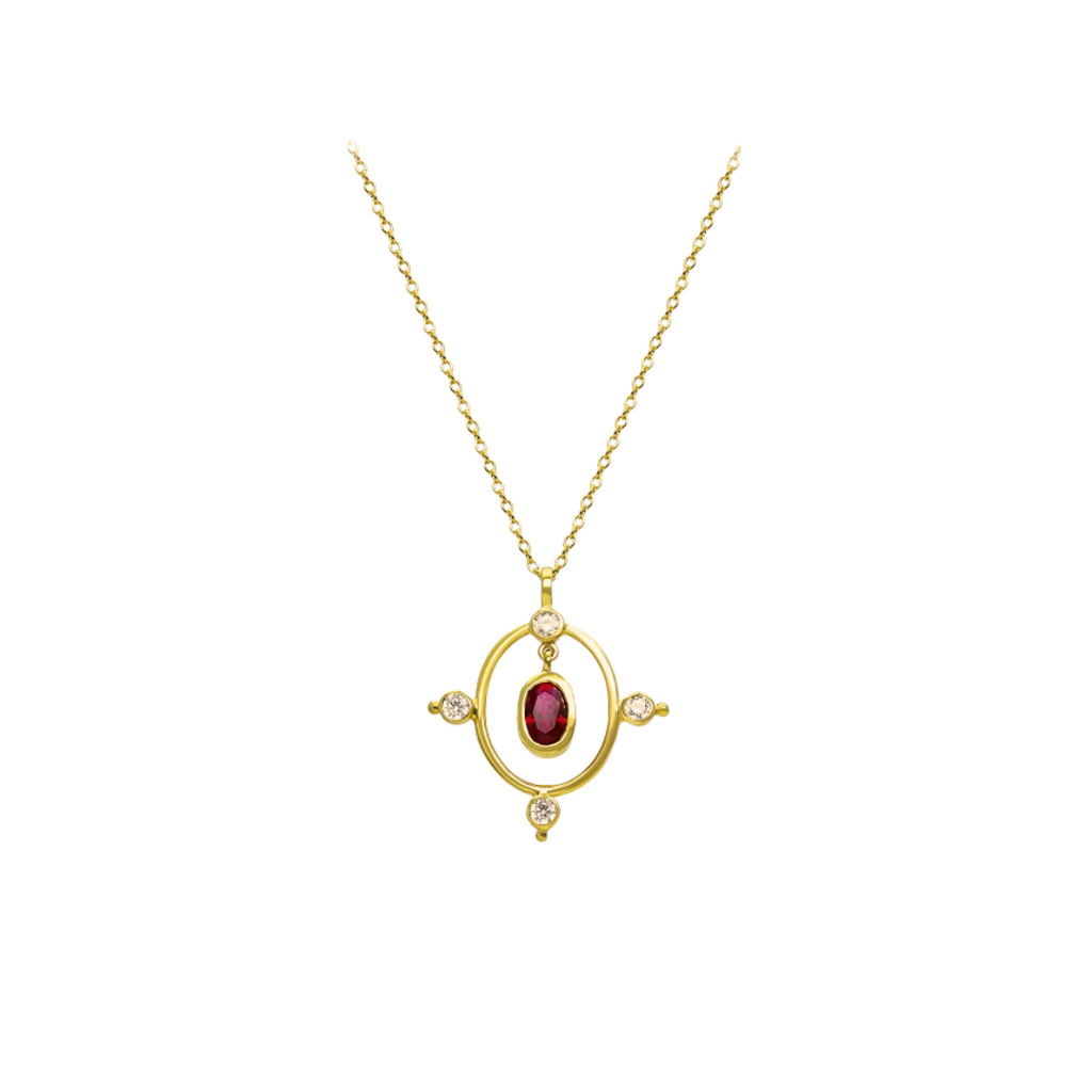 Gold necklace with a red gemstone pendant on a white background