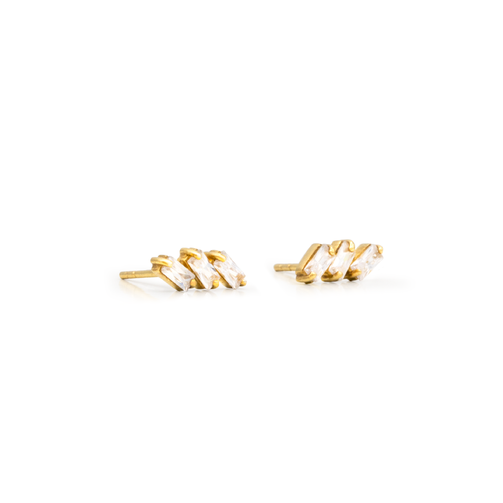A pair of gold-colored Genêve earrings featuring white zircon stones, designed in a sleek, elegant style.