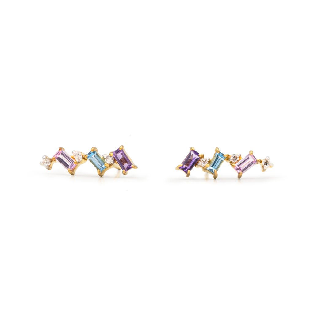 A pair of earrings featuring a series of pastel-colored stones in a row, set in a gold-tone mounting.
